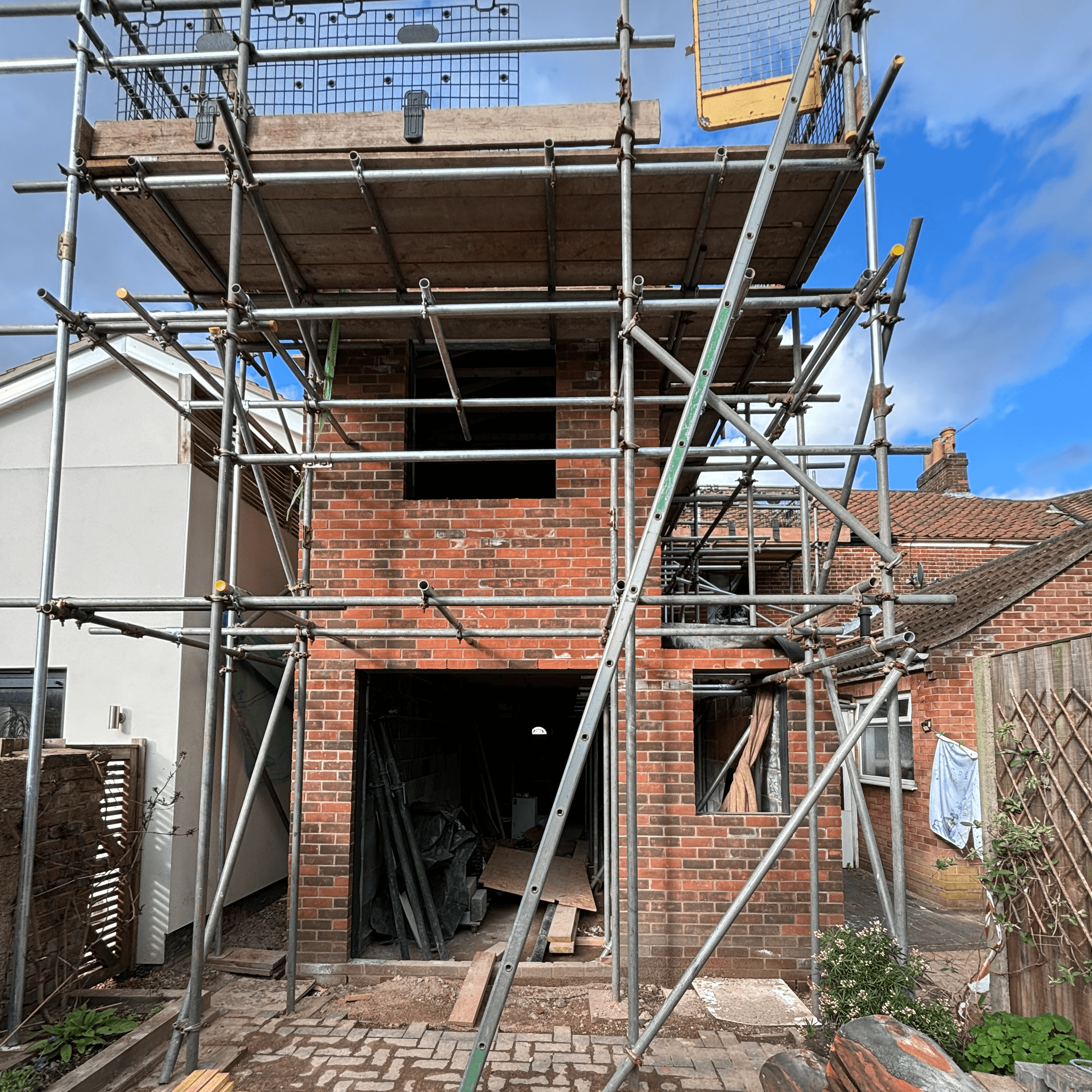 Partially completed back extention for terraced house with scaffolding in place
